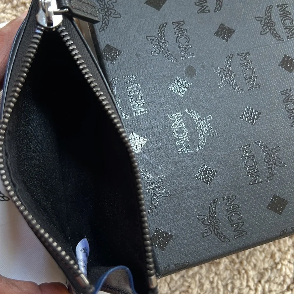 MCM men's lion embossed black with blue and grey mini zipped coin card holder